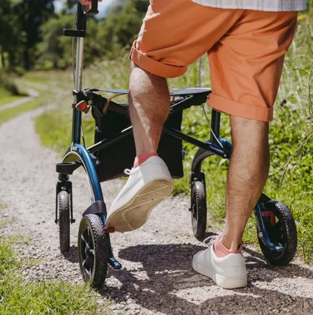 A man uses a slow down brake on a saljol Carbon walking frame