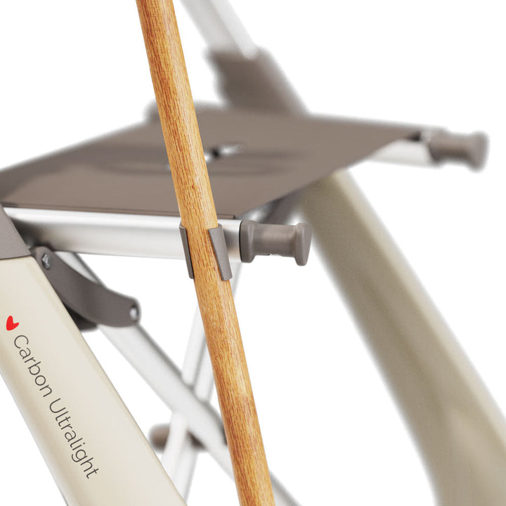A close up of a cane holder attached to a byACRE ultralight walker