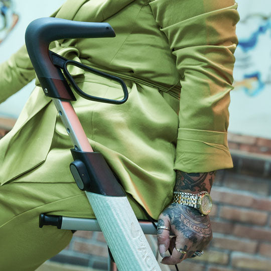 A close up of the handles on a byACRE Nordic Pioneer walking frame