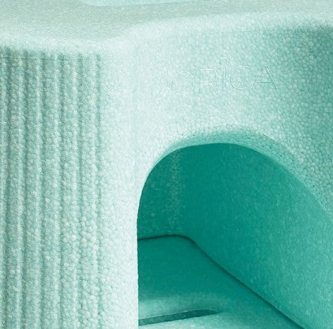 Close-up of the Dorica shower stool with a textured pattern
