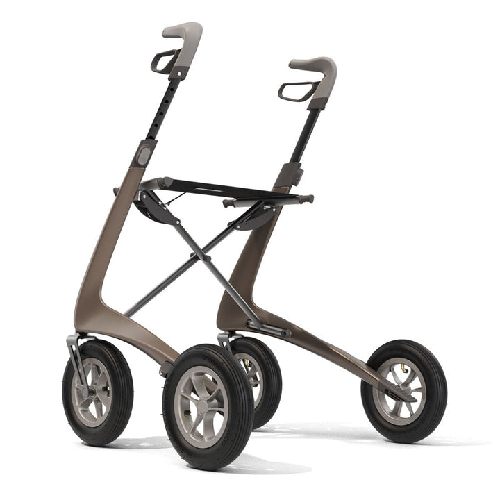 A brown 'byACRE Carbon Overland' walking frame, on a white background, rear left side.