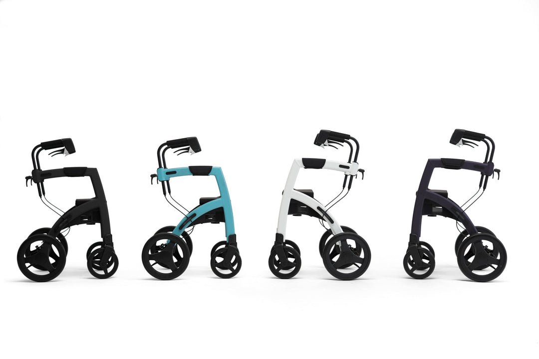 Four different coloured 'Rollz Motion' walking frames on a white background