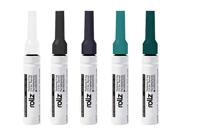 Five Rollz touch up pens in different colours on a white background